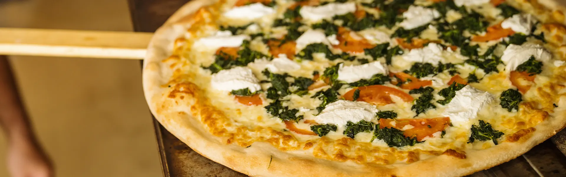 Margarita Pizza going into an oven in Hockessin, DE